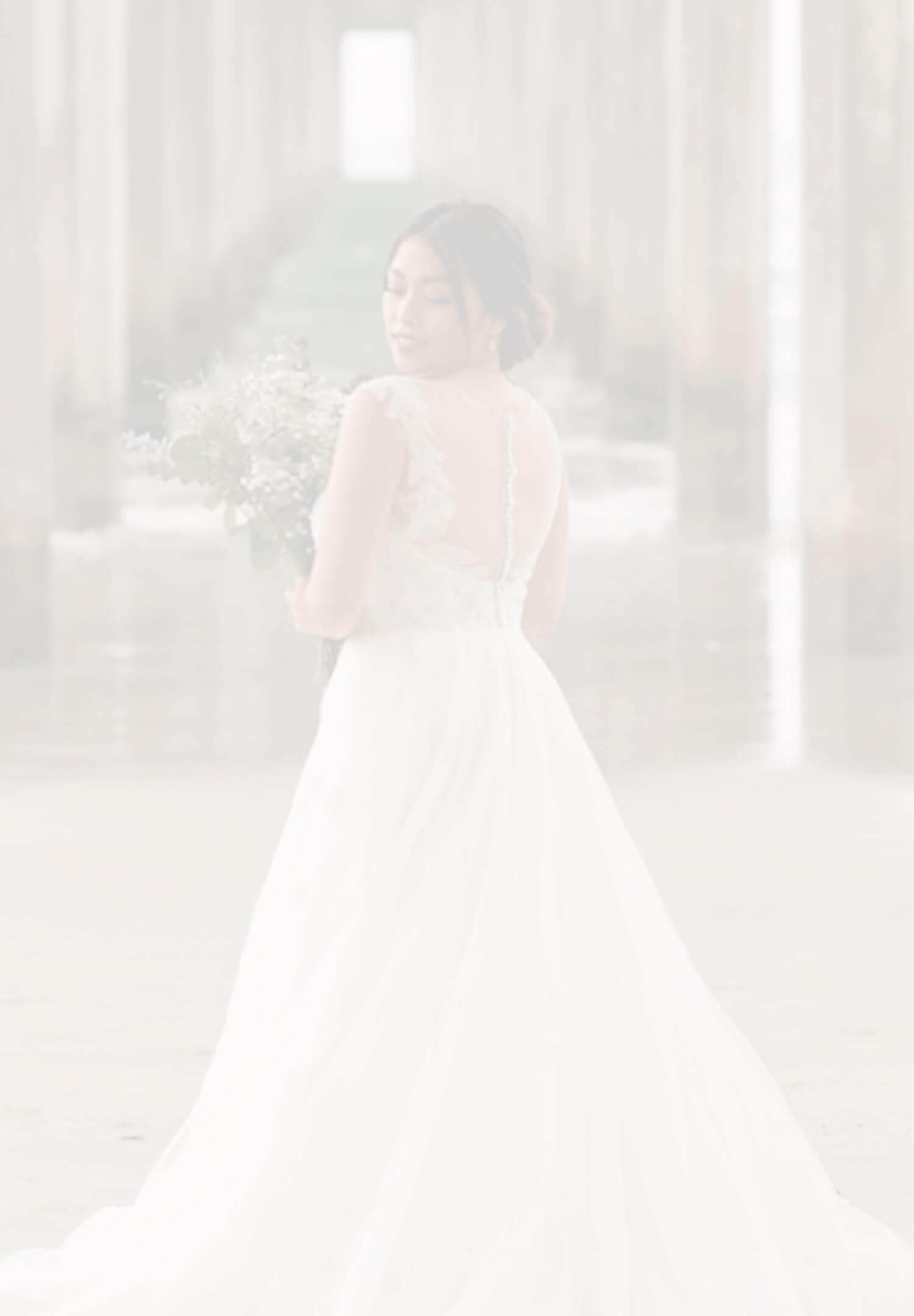 Model wearing a white gown. Mobile image