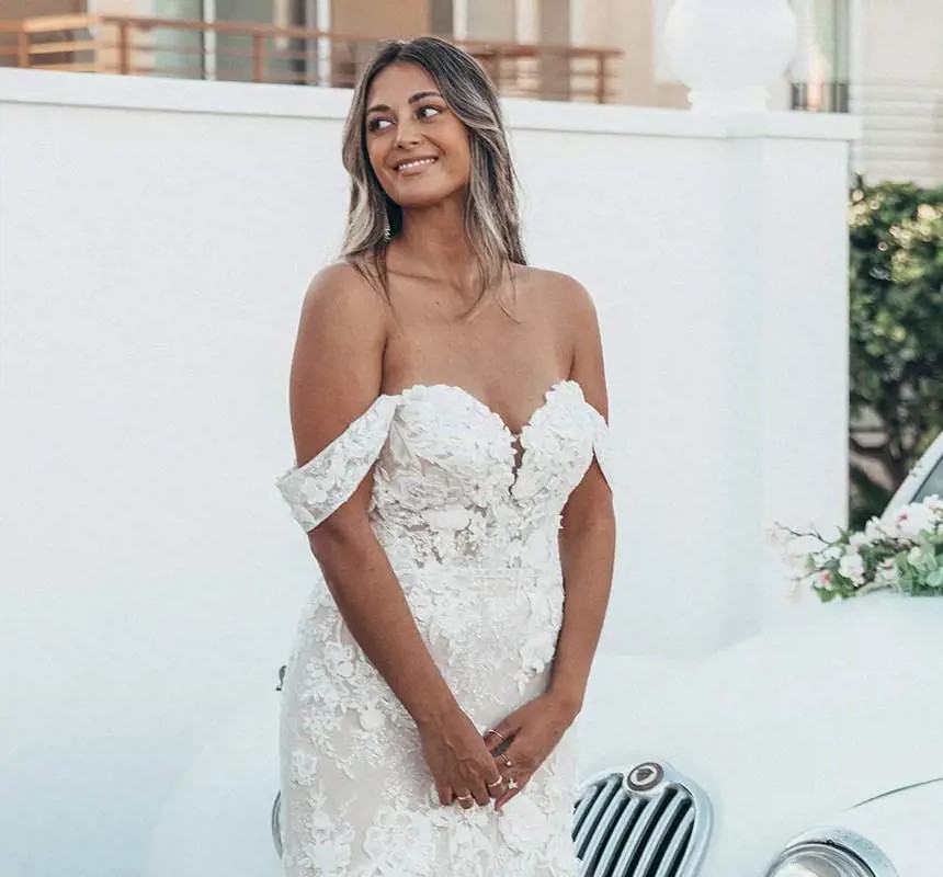 Model wearing a white gown by Essense of Australia