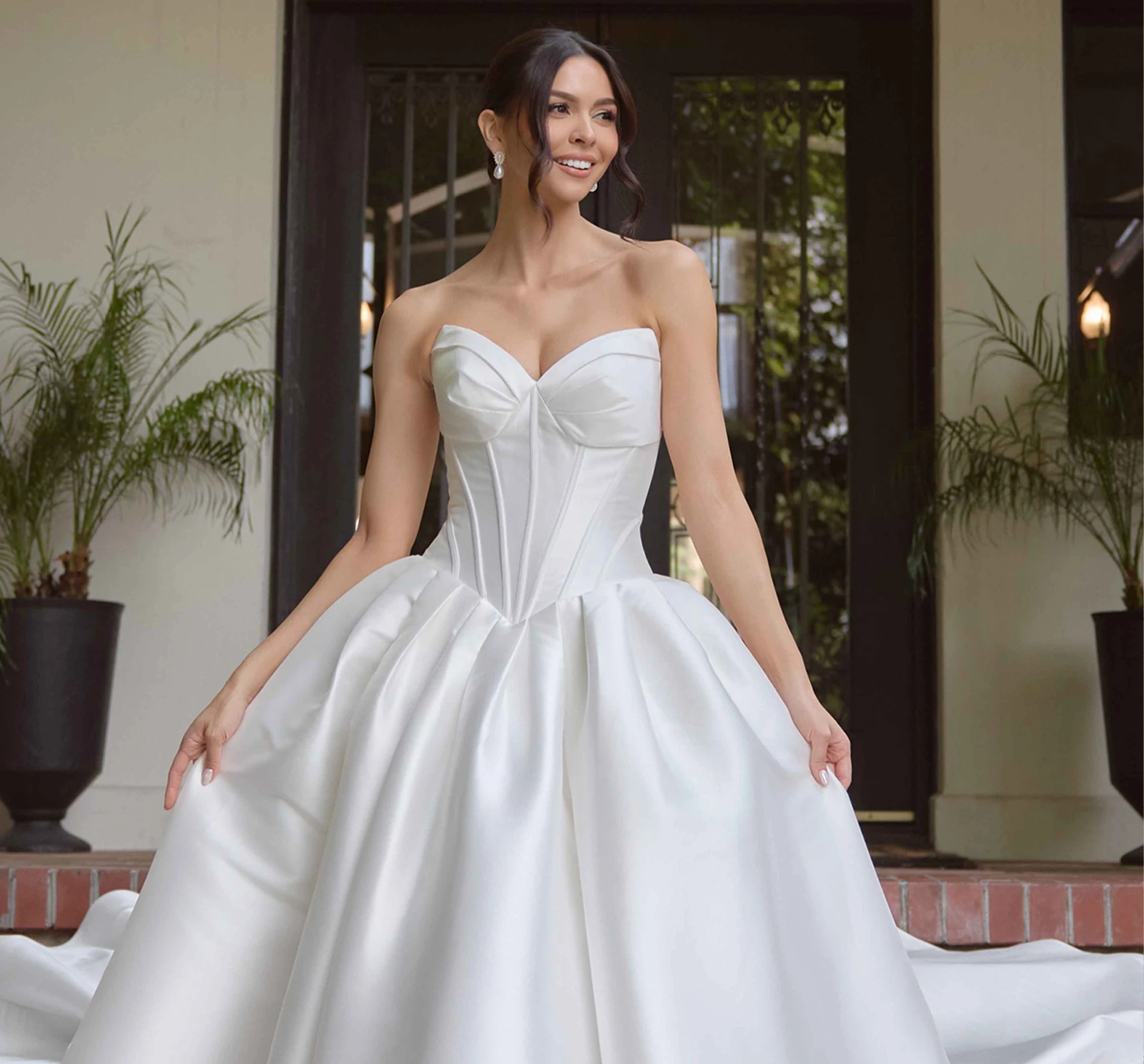 Model wearing a white gown by Essense of Australia