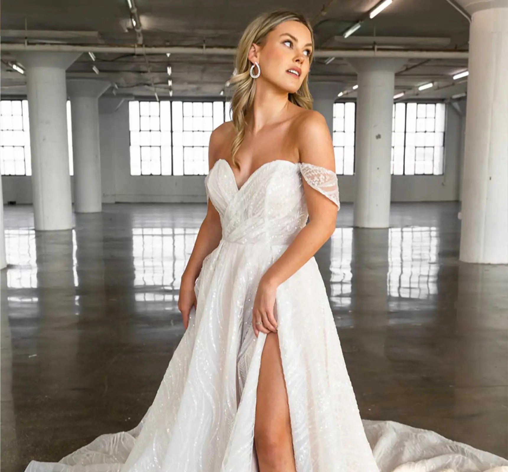 Model wearing a white gown by Essense of Australia